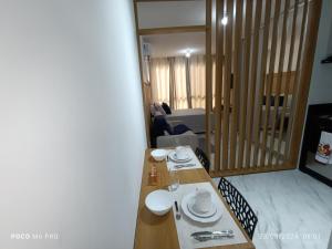 a dining room table with plates and dishes on it at Apto Praia Intermares Cabedelo Paraiba Q208 in Nossa Senhora do Livramento +32 photos