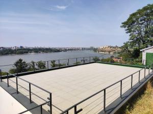 deck with a view of the river at Kaskade Hill Apartments in Novi Sad