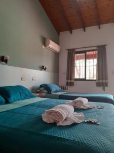 Postel nebo postele na pokoji v ubytování Apart Hotel Nonquen