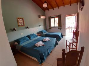 Postel nebo postele na pokoji v ubytování Apart Hotel Nonquen