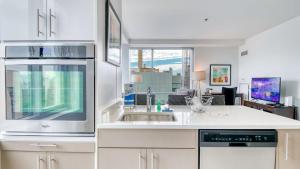 a kitchen with a sink and a microwave at Luxury Apt Near Charles River in Cambridge