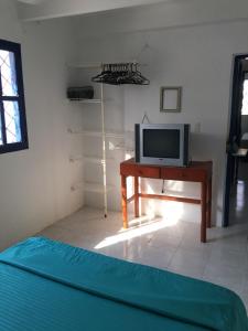 TV a/nebo společenská místnost v ubytování CASAMARAZUL Beach house