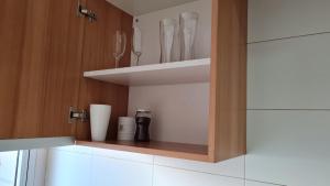 a kitchen with a cupboard with utensils at AeroDpto Centrico a minutos del Aeropuerto in Ezeiza