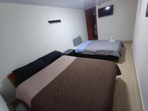 Łóżko lub łóżka w pokoju w obiekcie Bohemia Hotel