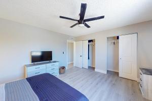 a bedroom with a bed and a ceiling fan at Tranquil Fountain Escape in Fountain Hills