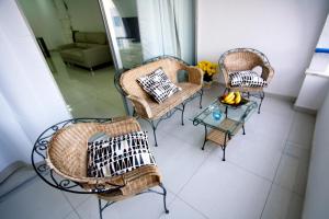 a living room with two chairs and a table at Pissouri Beach Apartments in Pissouri