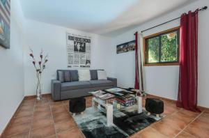 a living room with a couch and a table at Reina del Atlántico by Villas Rivero in Candelaria