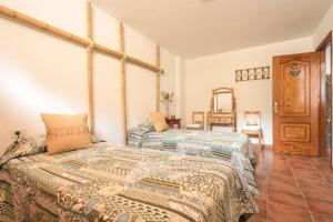 a bedroom with two beds in a room at Reina del Atlántico by Villas Rivero in Candelaria +27 photos