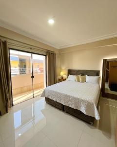 Ένα ή περισσότερα κρεβάτια σε δωμάτιο στο Darling Hotel Ciudad del Este