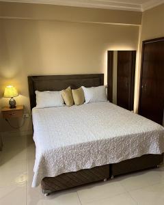 Ένα ή περισσότερα κρεβάτια σε δωμάτιο στο Darling Hotel Ciudad del Este