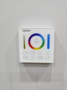 an electronic clock with the words microsoft on it at Emma's Cottage in Debrecen
