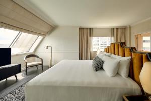 a bedroom with a large bed and a television at Loews Nashville Hotel at Vanderbilt Plaza in Nashville +138 photos