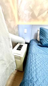 Cama ou camas em um quarto em Encantador Apartamento Em Frente Ao Metrô Brás ! - Rua Coronel Mursa, 56 - Bras