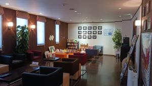 a waiting room with couches and tables in a store at Dormy Club Karuizawa in Karuizawa +23 photos