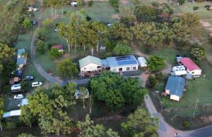 an aerial view of a house with a yard at Tamarind Gardens Camping, Caravans, Accommodation in Almaden