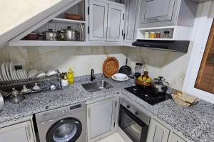A kitchen or kitchenette at Bunga SMART