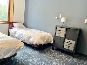 Postel nebo postele na pokoji v ubytování Ember Lodge - Hakuba