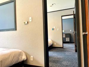 Postel nebo postele na pokoji v ubytování Ember Lodge - Hakuba