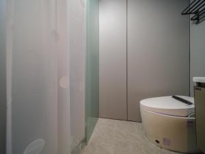 Koupelna v ubytování 浅予酒店 青岛北站店