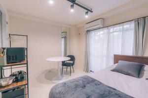 Μια τηλεόραση ή/και κέντρο ψυχαγωγίας στο unito residence KYOTO Takasegawa