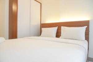 Ένα ή περισσότερα κρεβάτια σε δωμάτιο στο Simply Look Studio Tokyo Riverside PIK 2 Apartment By Travelio