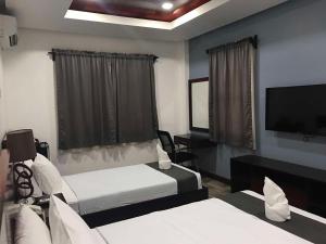 Postel nebo postele na pokoji v ubytování Hotel Gabriella