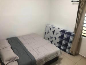 Ένα ή περισσότερα κρεβάτια σε δωμάτιο στο Happy Guest House Nibong Tebal 开心民宿高渊区