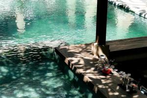 a view of a body of water from a boat at Fourteen Roses Beach Hotel in Legian +42 photos