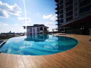 a large swimming pool on top of a building at A Tower View Home in Sibu