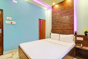 Postel nebo postele na pokoji v ubytování Super Hotel O The Orchid Residency