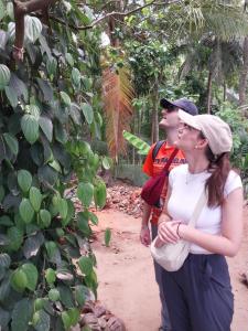 a man and a woman standing next to a tree at Ridge Boundary View in Dambulla