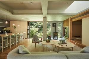 a living room with a couch and a table at Shibi in Nara
