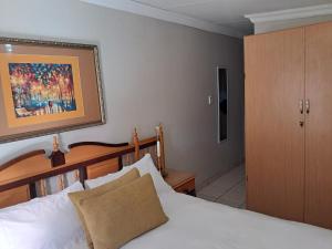 Postel nebo postele na pokoji v ubytování Jakkalsdraai Guest House