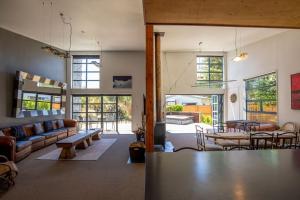 a living room with a couch and a table at Casa Del Caird in Methven