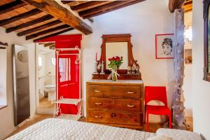 Postel nebo postele na pokoji v ubytování Romantic & Charming appartamento in centro storico Cuore di Toscana