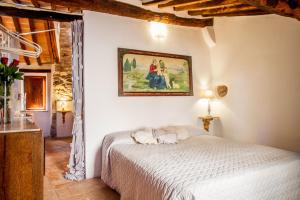 Postel nebo postele na pokoji v ubytování Romantic & Charming appartamento in centro storico Cuore di Toscana
