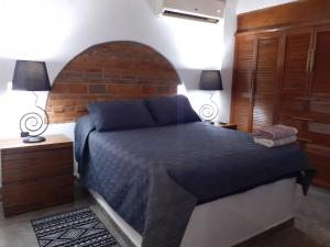 Voodi või voodid majutusasutuse Aparta-Hotel CASA REAL Apartamentos toas