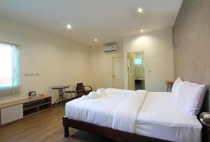 Postel nebo postele na pokoji v ubytování ZAYN Samui Hotel