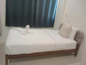 Postel nebo postele na pokoji v ubytování ZAYN Samui Hotel