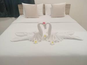 Postel nebo postele na pokoji v ubytování ZAYN Samui Hotel