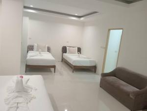 Postel nebo postele na pokoji v ubytování ZAYN Samui Hotel