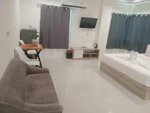 Postel nebo postele na pokoji v ubytování ZAYN Samui Hotel