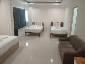 Postel nebo postele na pokoji v ubytování ZAYN Samui Hotel