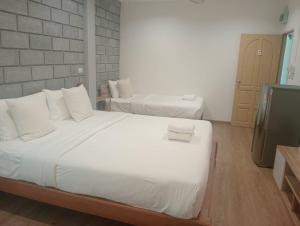 Postel nebo postele na pokoji v ubytování ZAYN Samui Hotel