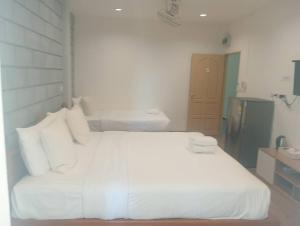 Postel nebo postele na pokoji v ubytování ZAYN Samui Hotel