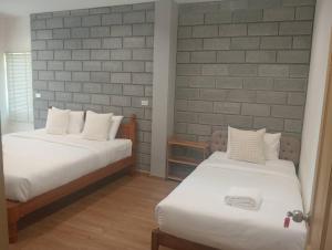 Postel nebo postele na pokoji v ubytování ZAYN Samui Hotel