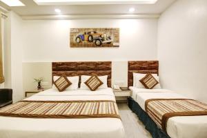 Postel nebo postele na pokoji v ubytování Hotel All Iz Well - Traveller Choice Award winner 2025