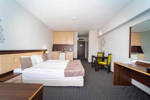 Postel nebo postele na pokoji v ubytování MPM Hotel Guinness