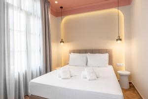 Postel nebo postele na pokoji v ubytování Atlas Boutique Suites + 37 fotografií