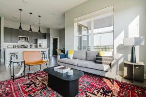 a living room with a couch and a table at Blueground Lost Plains pool pet area wd ATX-271 in Austin